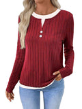 Women's grey fake two-piece striped pullover sweater with round neck and button detail.