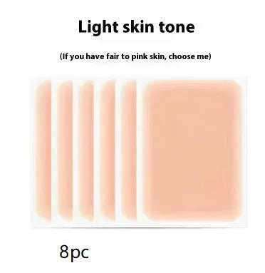 Pack of adhesive tattoo cover patches in various skin tone colours on a white background.