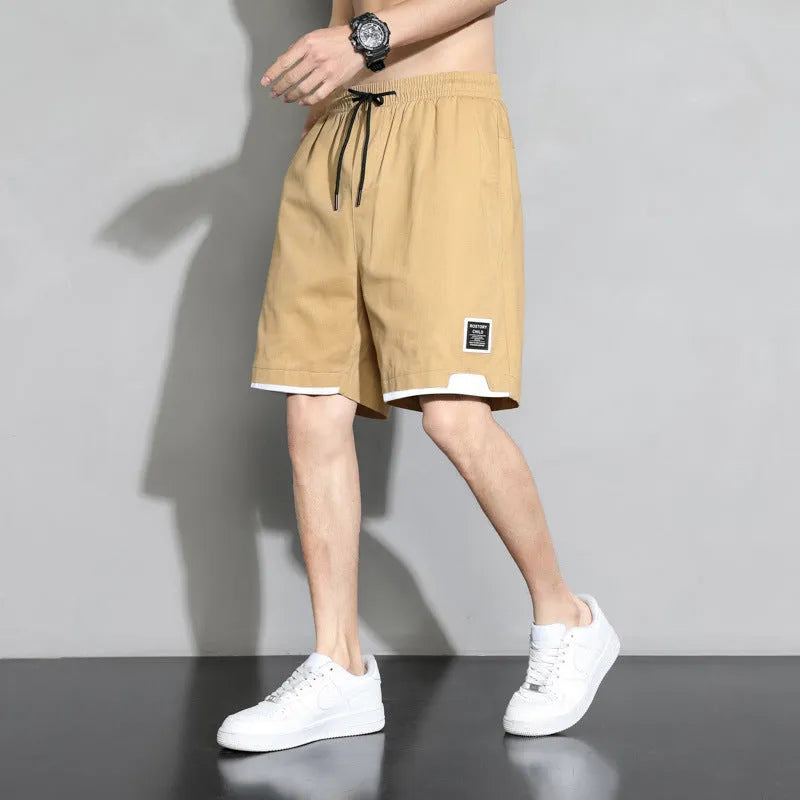 Boys' loose-fit cotton shorts in black, available in plus sizes for summer comfort.