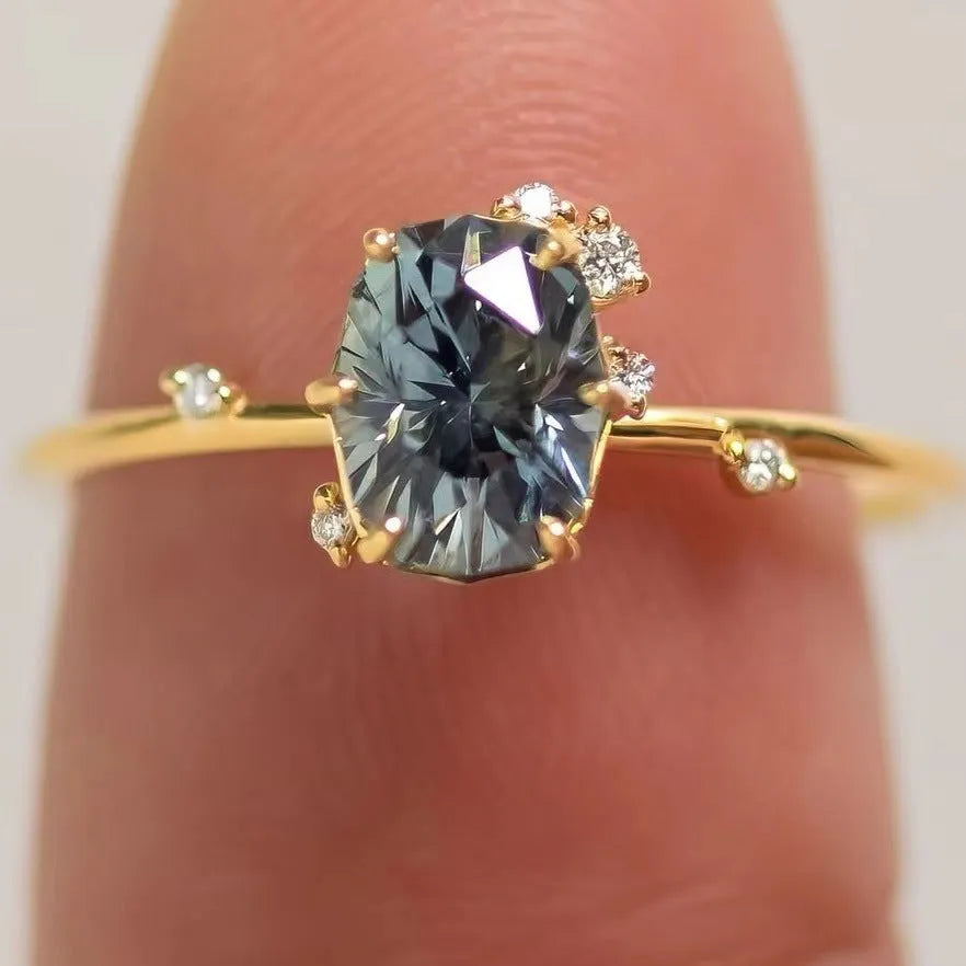 Gold plated flower ring with green zircon stones on display