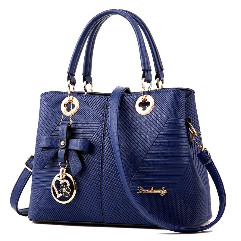 Retro PU leather handbag with zipper closure and shoulder strap in assorted colours