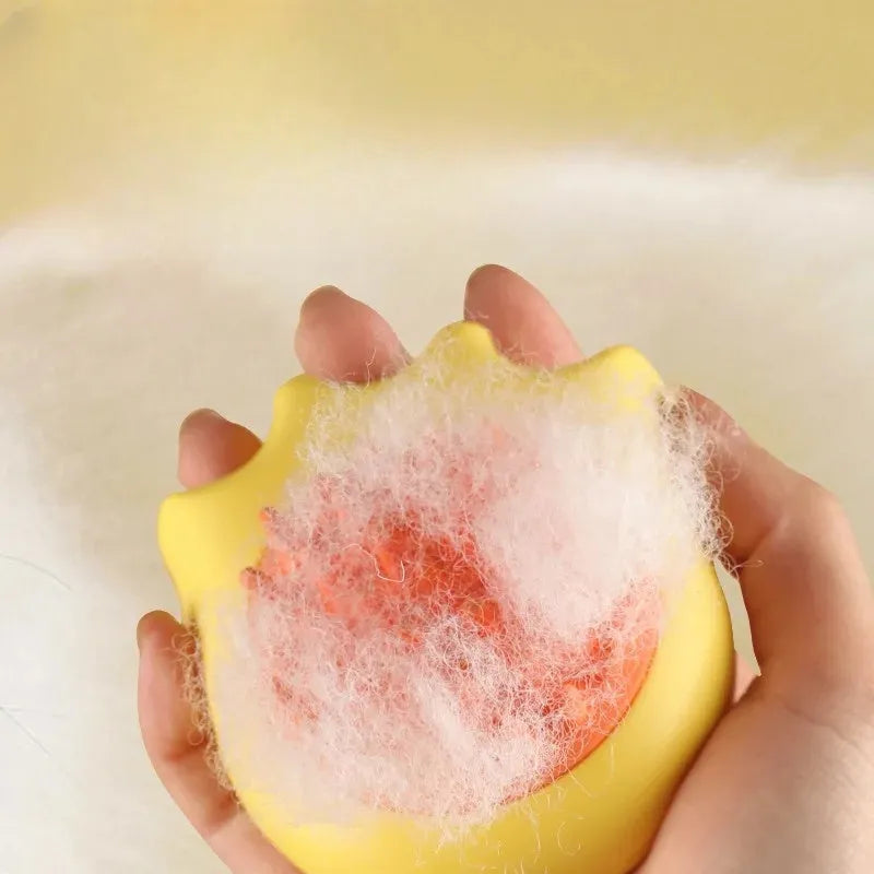Plastic pet bath brush with built-in shampoo box measuring 9cm long