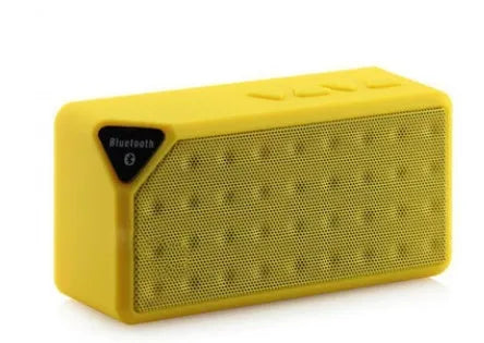Cannon X3 cube-shaped wireless Bluetooth speaker shown in black, blue, green, red, and yellow colour options.