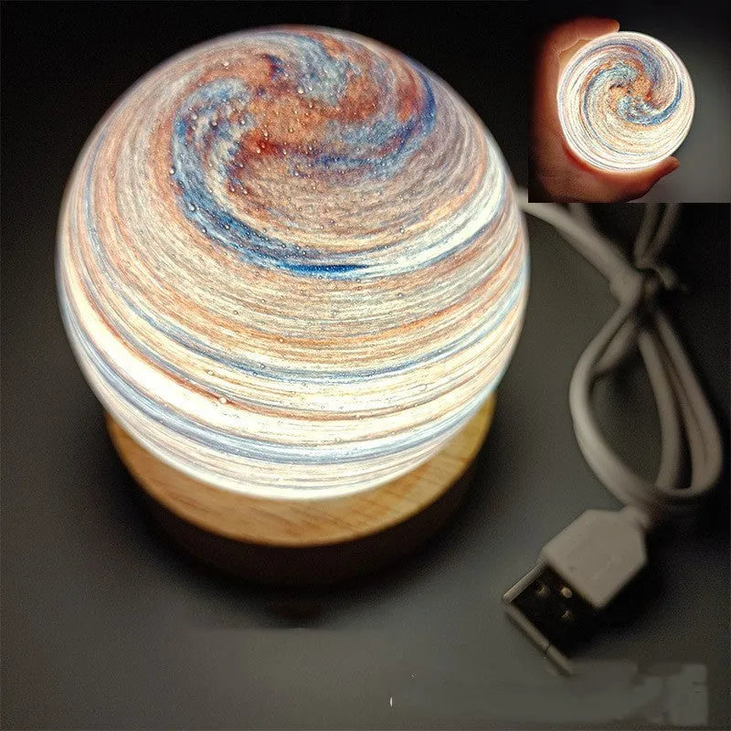Planet-themed night light with USB cable and base, showing 80mm diameter globe