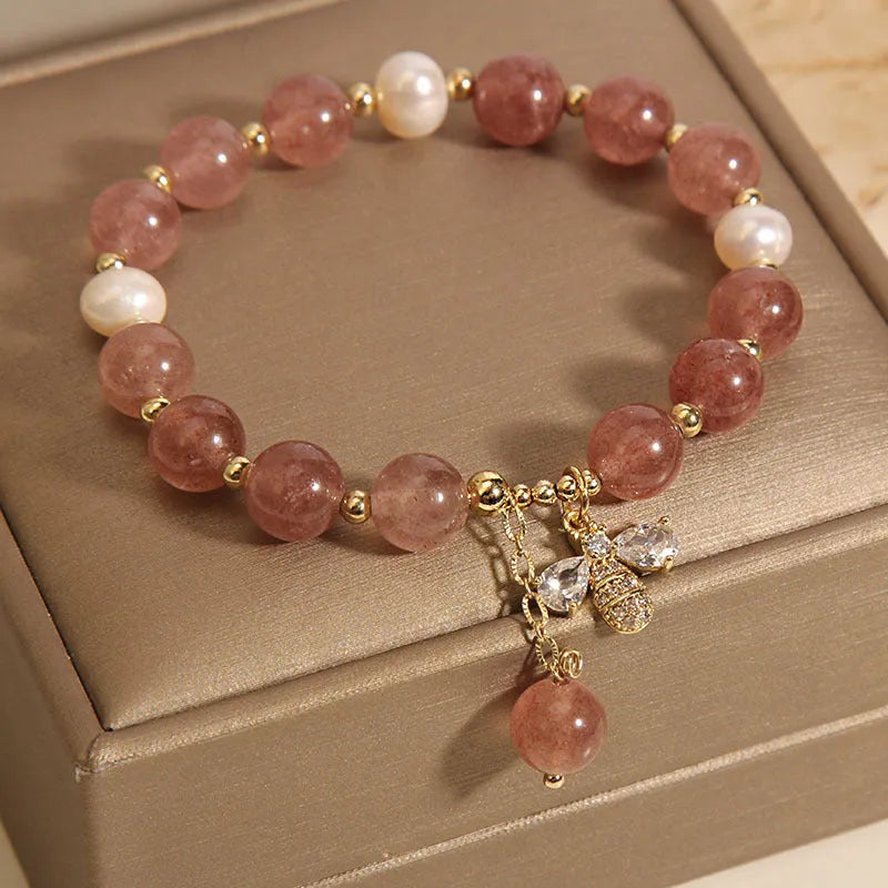 Women's strawberry quartz and freshwater pearl bracelet with zircon bee charm in Japanese-Korean jewellery style