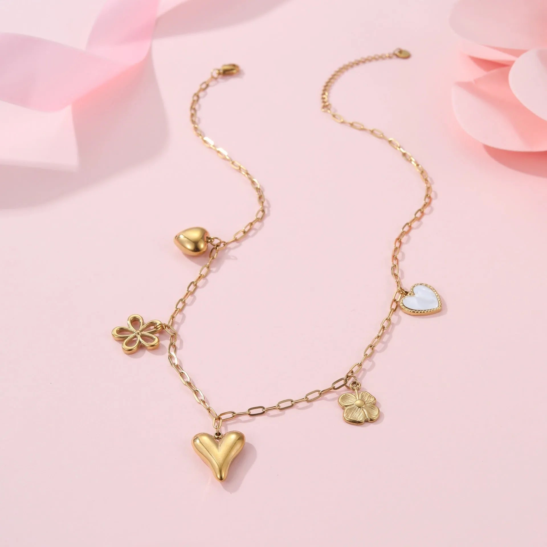 Stainless steel necklace with 18K gold electroplating and a geometric pendant, shown on a regular chain.