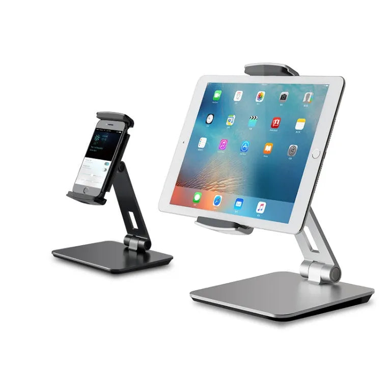 Silver foldable aluminium stand holding a tablet at an angle on a desk