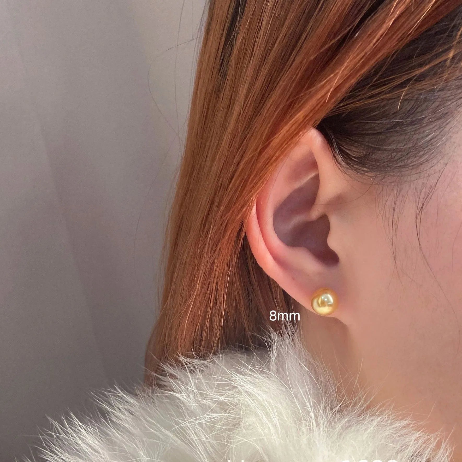 Women's large pearl stud earrings with an eight-pointed star geometric setting in sterling silver.