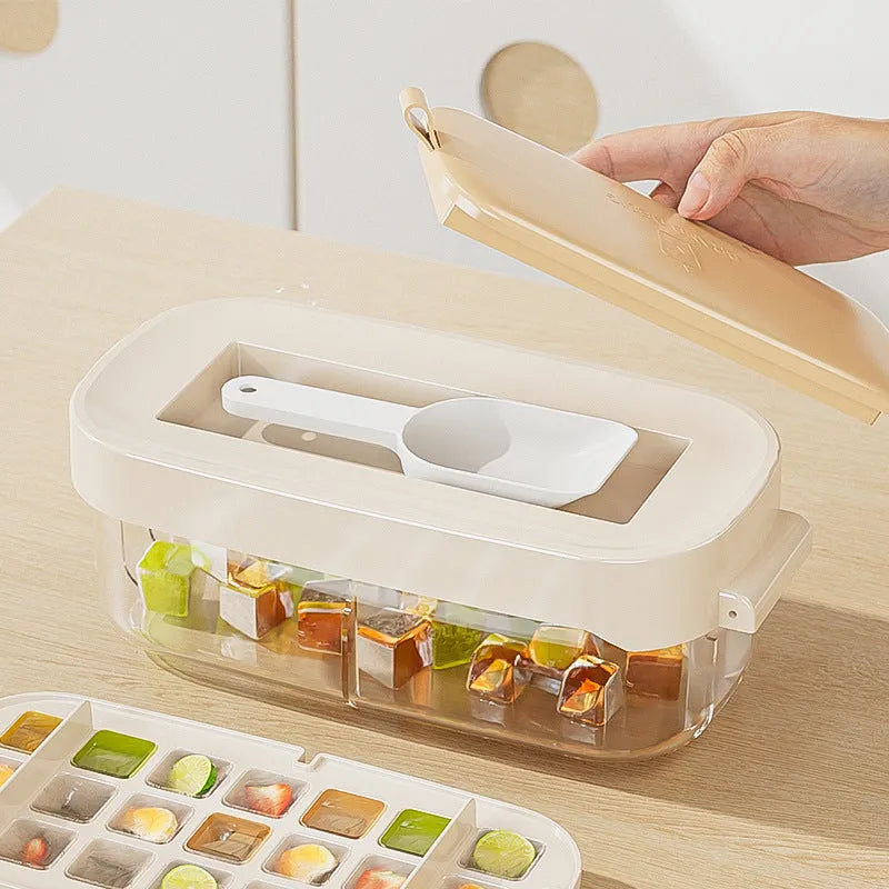 Blue food-grade plastic ice cube tray with grid design and integrated ice shovel storage.