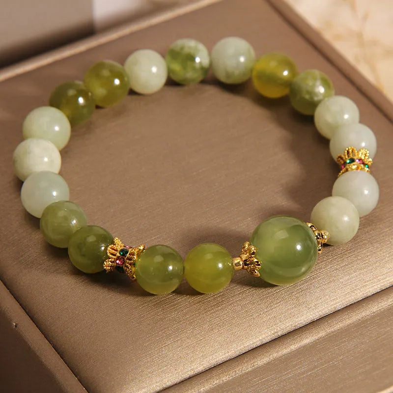 Xiuyan jade women's bracelet in jade green colour with natural stone patterns and Mori-style design