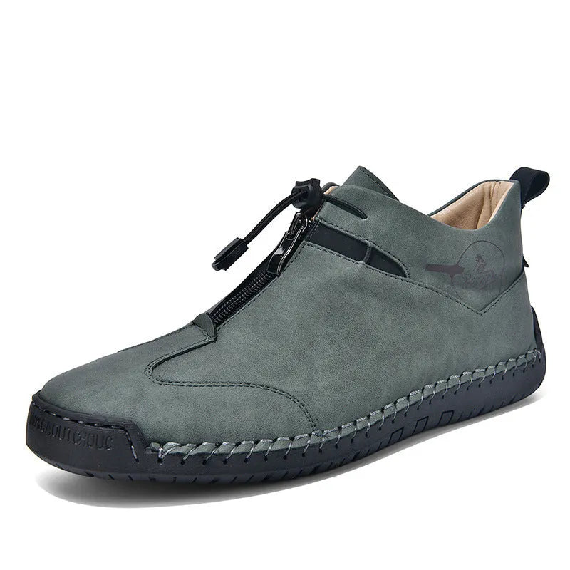 Men's casual leather shoe in green with a tall crown, round toe, mid heel, and rubber sole.