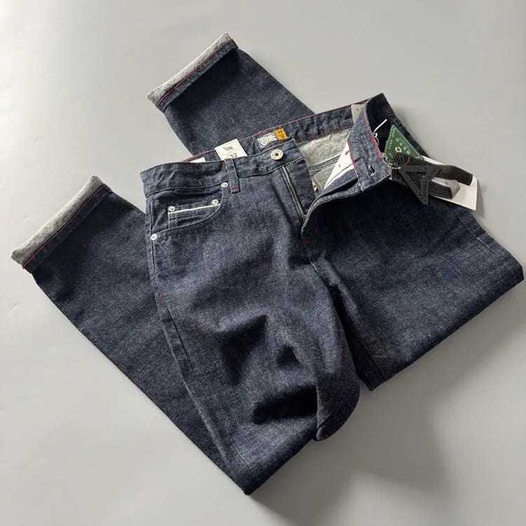 Men's straight-leg cotton denim trousers in a primary colour wash, showing mid-waist fit.