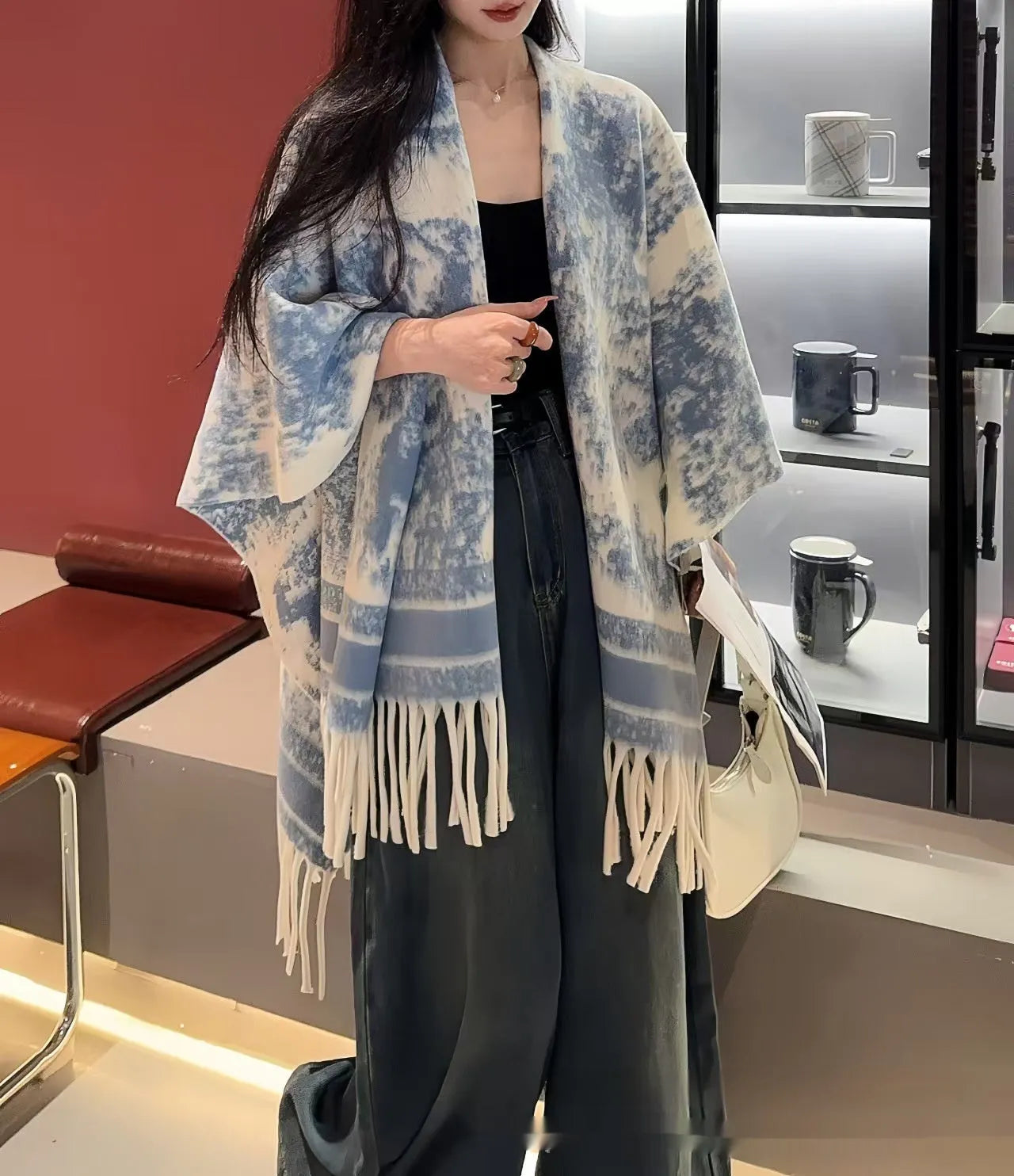 Women's polyester scarf cape with long fringed tassels, shown in a selection of available colours.