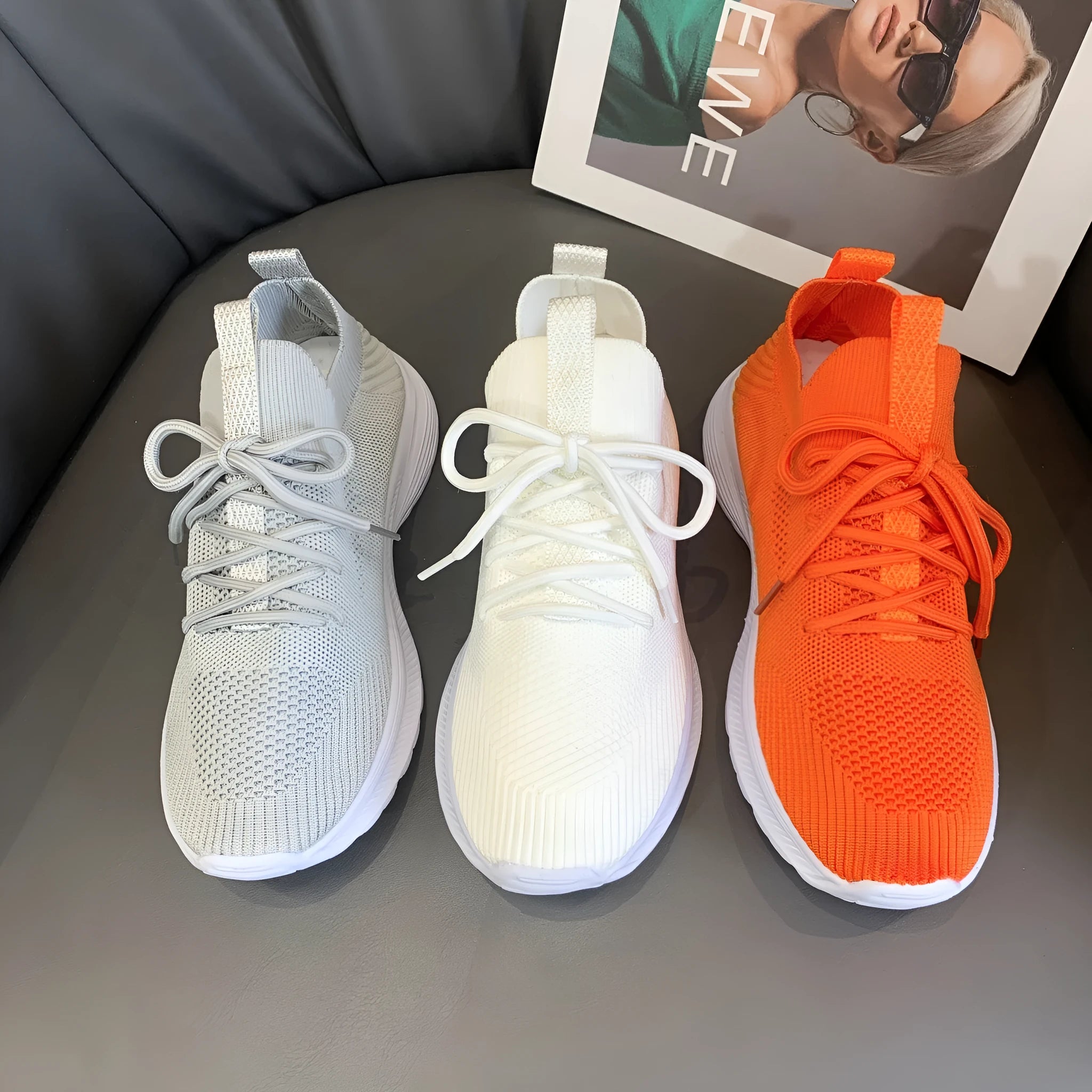 Women's mesh running shoes in Creamy White with Flyknit upper and low-top design