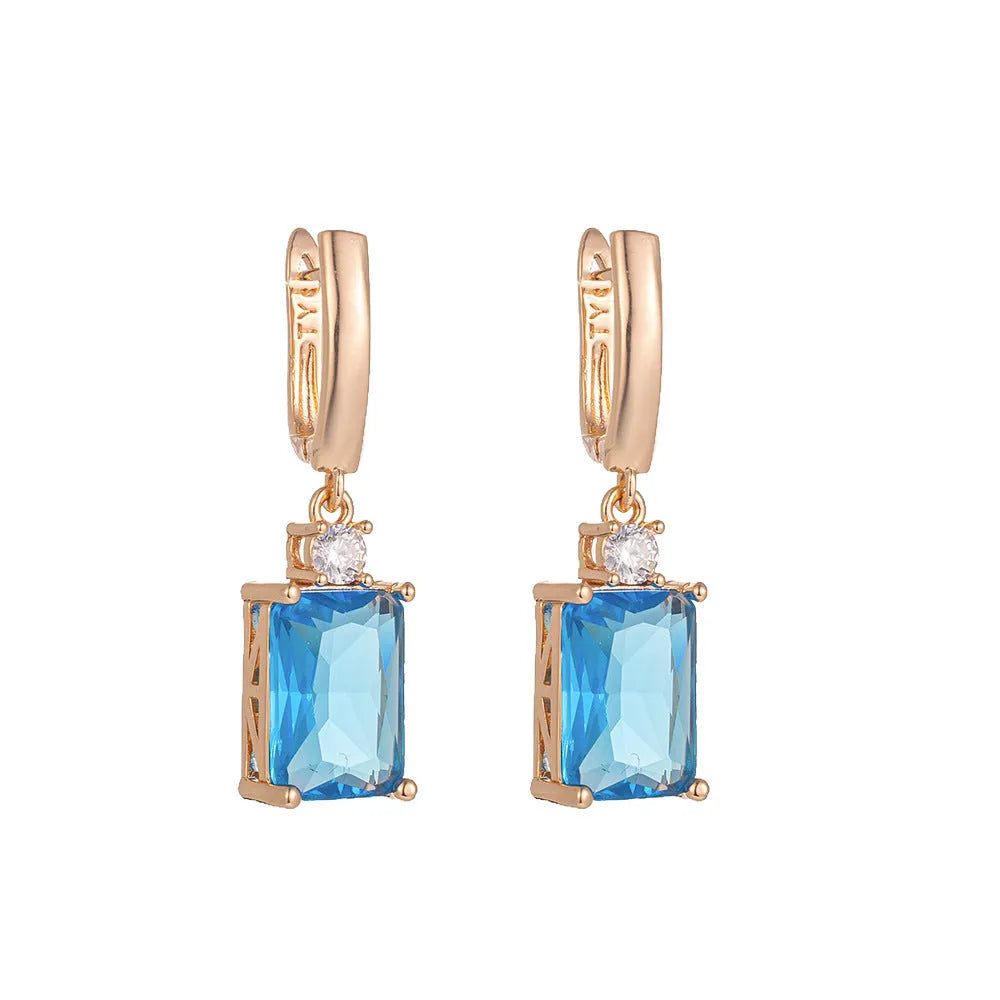 Square geometric copper earrings with electroplated gold finish showing quadrilateral design elements