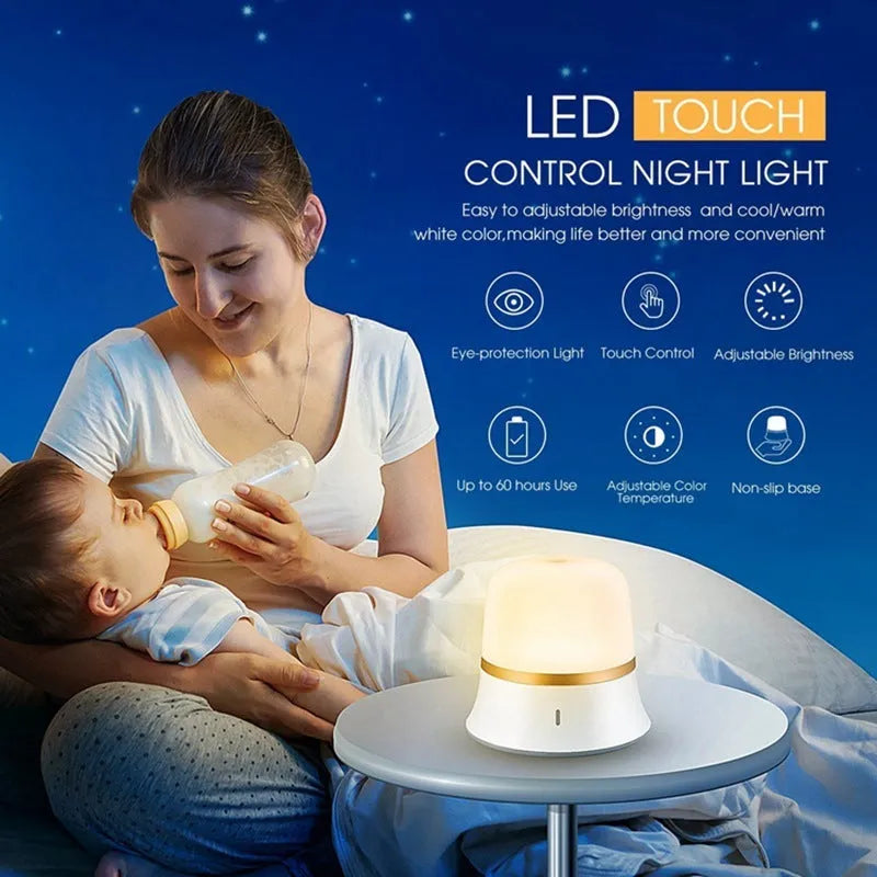 White cylindrical bedside night light with touch controls and motion sensor on a table.