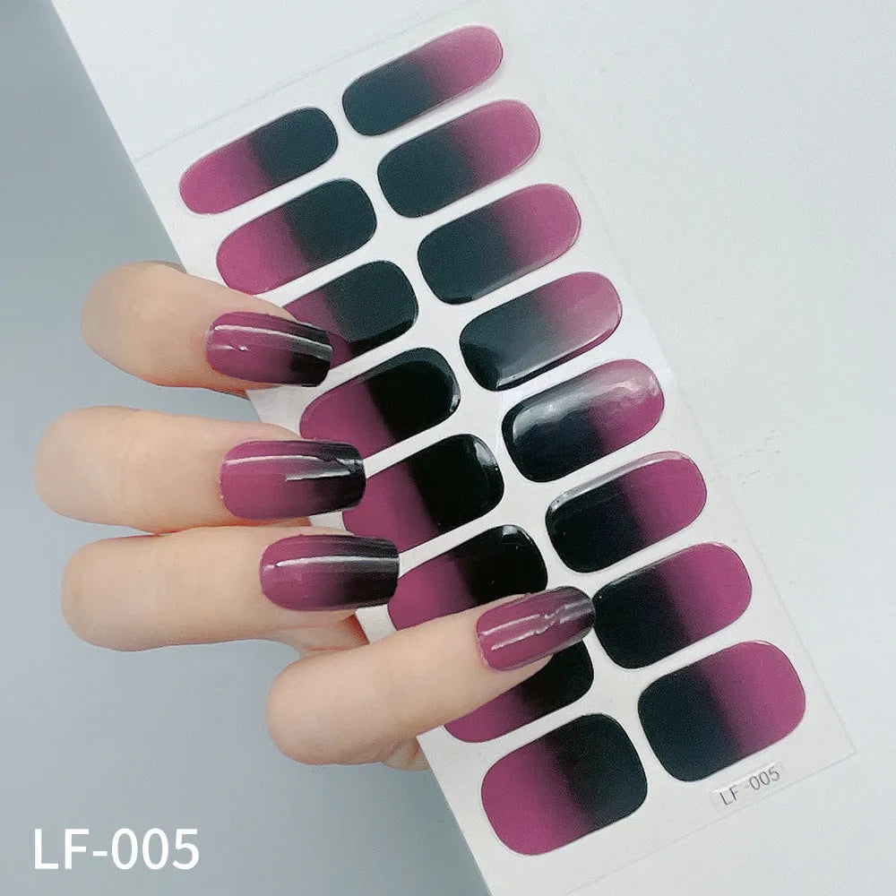 Set of 16 solid colour nail art stickers showing floral, geometric, and pattern designs for manicure application