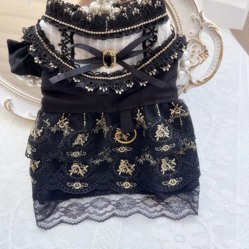 Golden Gothic princess skirt costume for a small dog on a mannequin.