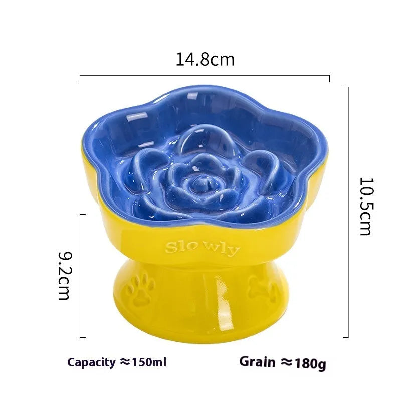 Black ceramic pet bowl with a chin-high foot and raised neck protector on a white background.