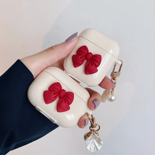 Beige red bow shell TPU AirPods protective case showing clamshell design