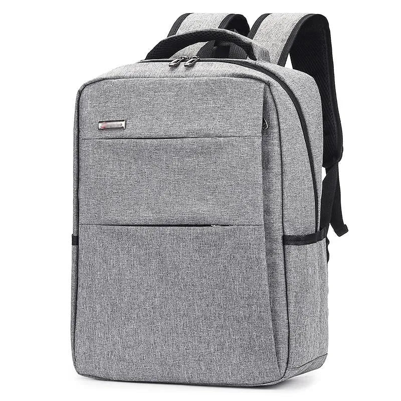 Black waterproof rechargeable backpack for a laptop, showing shoulder straps and a USB charging port.