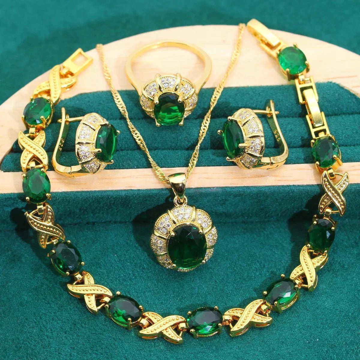 Gold plated cubic zirconia jewellery set showing necklace, earrings, ring, and bracelet with multi-colour stones