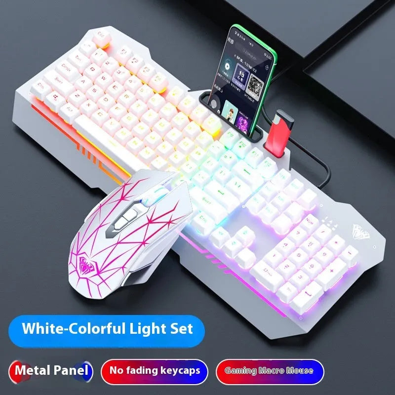 Black and white wired mechanical feeling keyboard, mouse, and headset bundle on a desk.