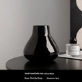 Black and white round belly ceramic decorative vase with optional artificial orchid flowers