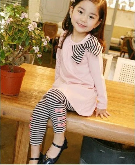 A pink cotton girls clothing co-ordinated set available in sizes 110cm, 120cm, 130cm, and 140cm.