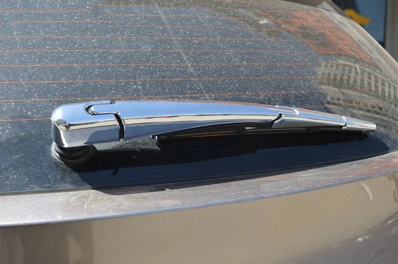 Set of four silvery ABS plastic rear window wiper cover trims for Hyundai 2010 model year vehicles.
