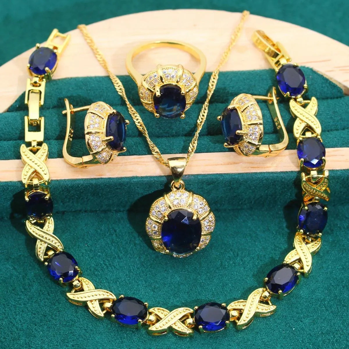 Gold plated cubic zirconia jewellery set showing necklace, earrings, ring, and bracelet with multi-colour stones