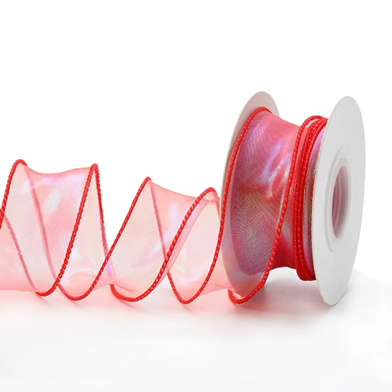Roll of 4cm wide mesh fishtail yarn floral wave ribbon in multiple illusion colours.