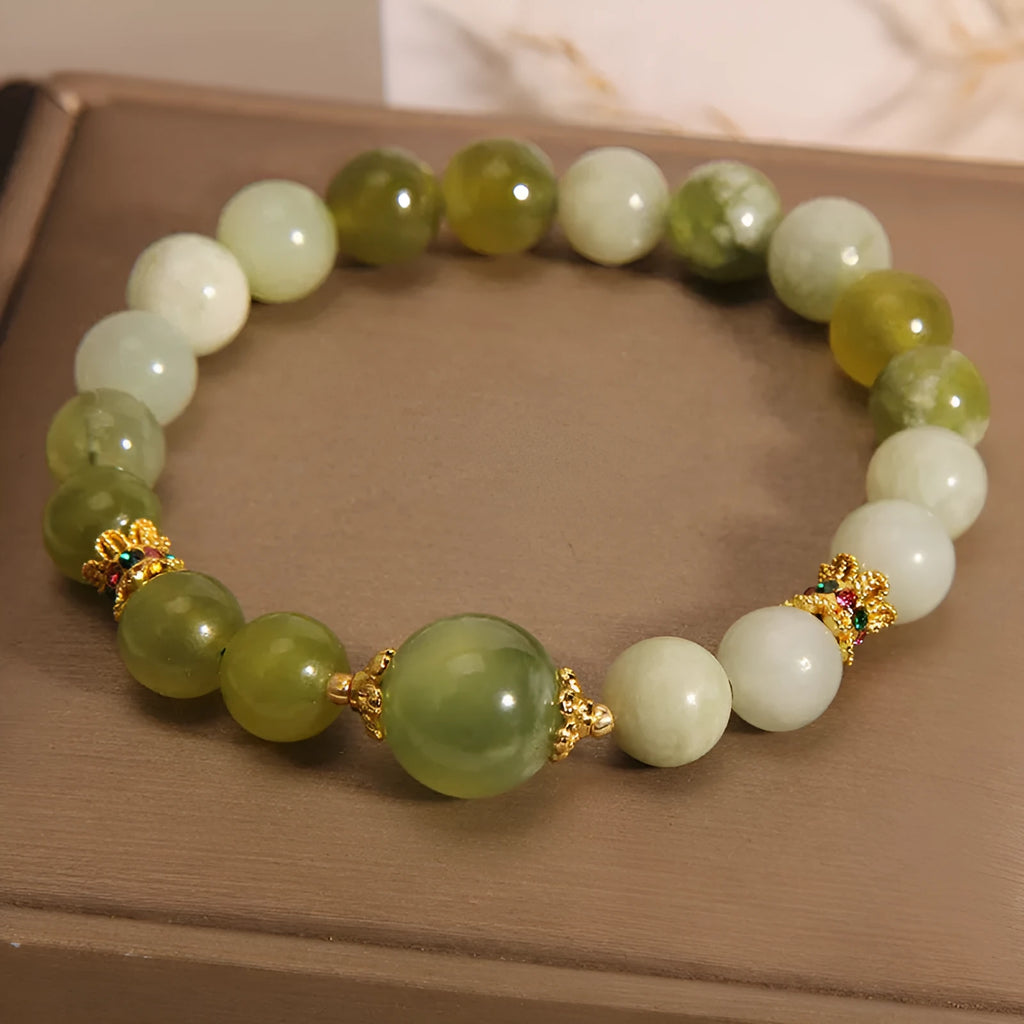Xiuyan jade women's bracelet in jade green colour with natural stone patterns and Mori-style design