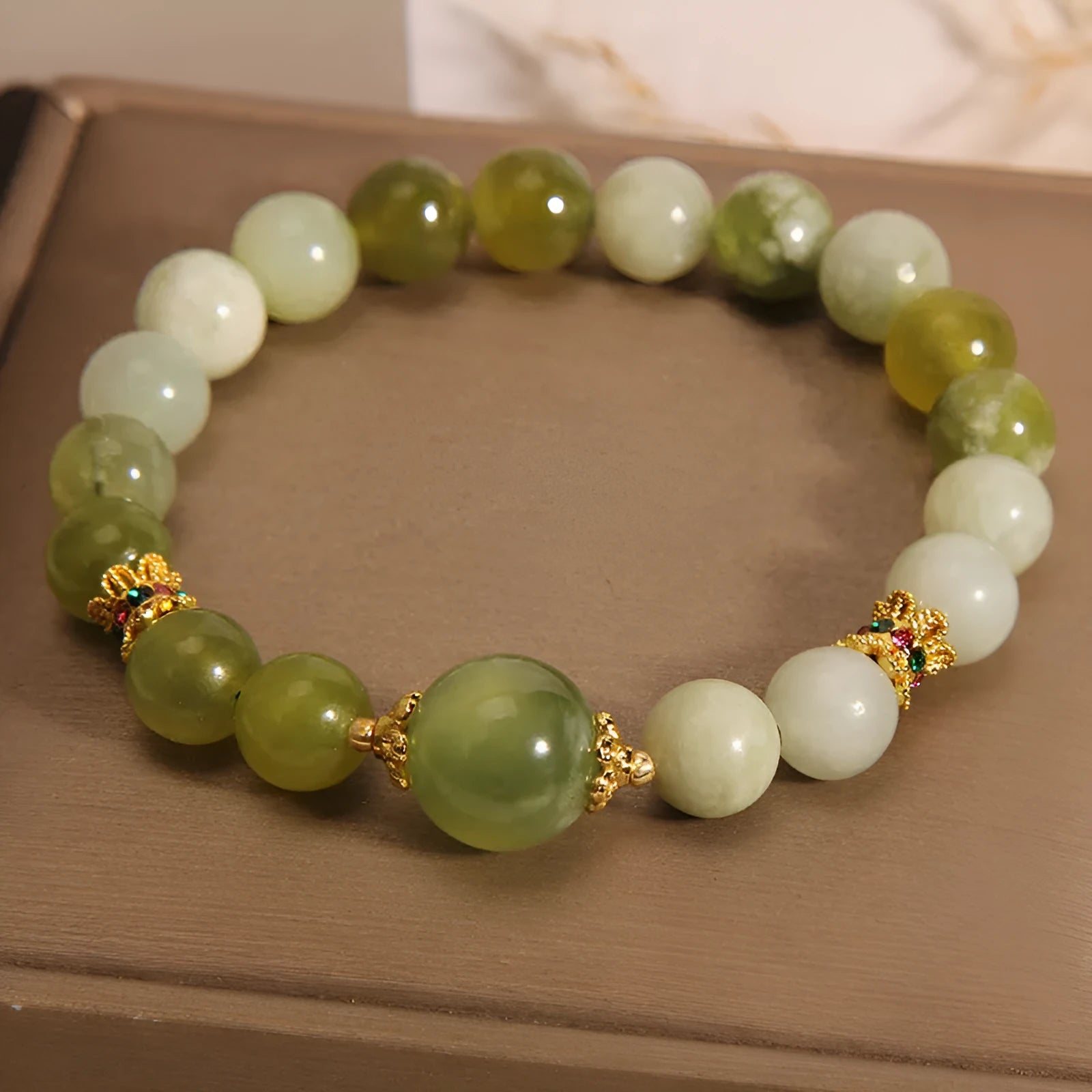 Xiuyan jade women's bracelet in jade green colour with natural stone patterns and Mori-style design