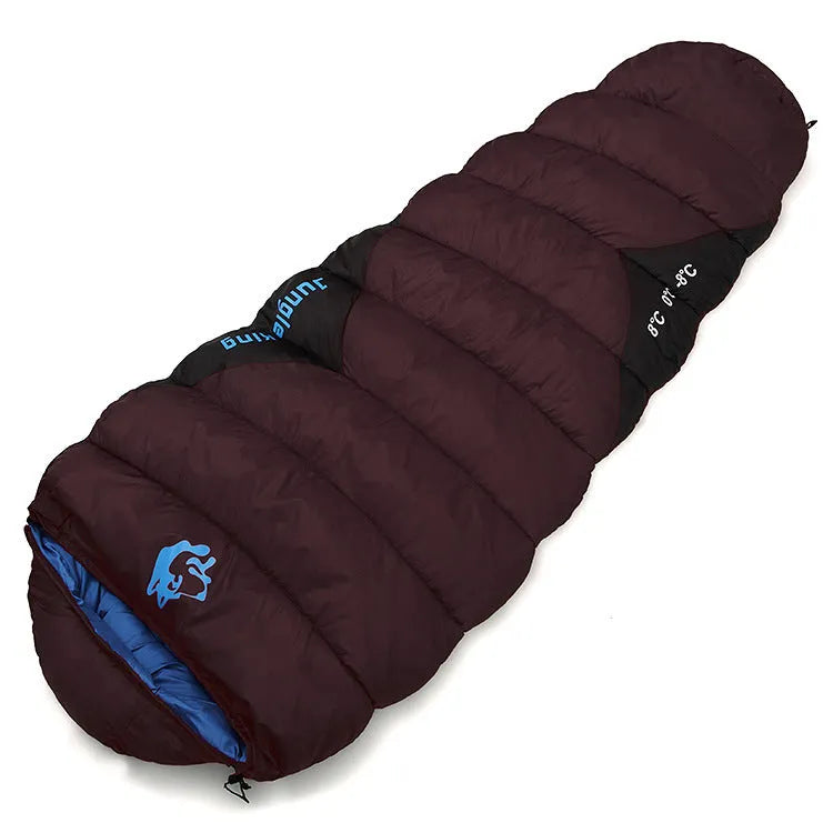 Outdoor cotton sleeping bag in army green, shown next to its grey compression storage sack