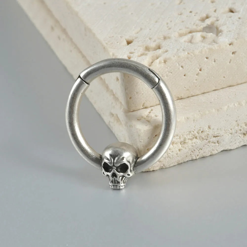 Copper punk earrings with ghost head designs in antique silver or ancient gold finishes