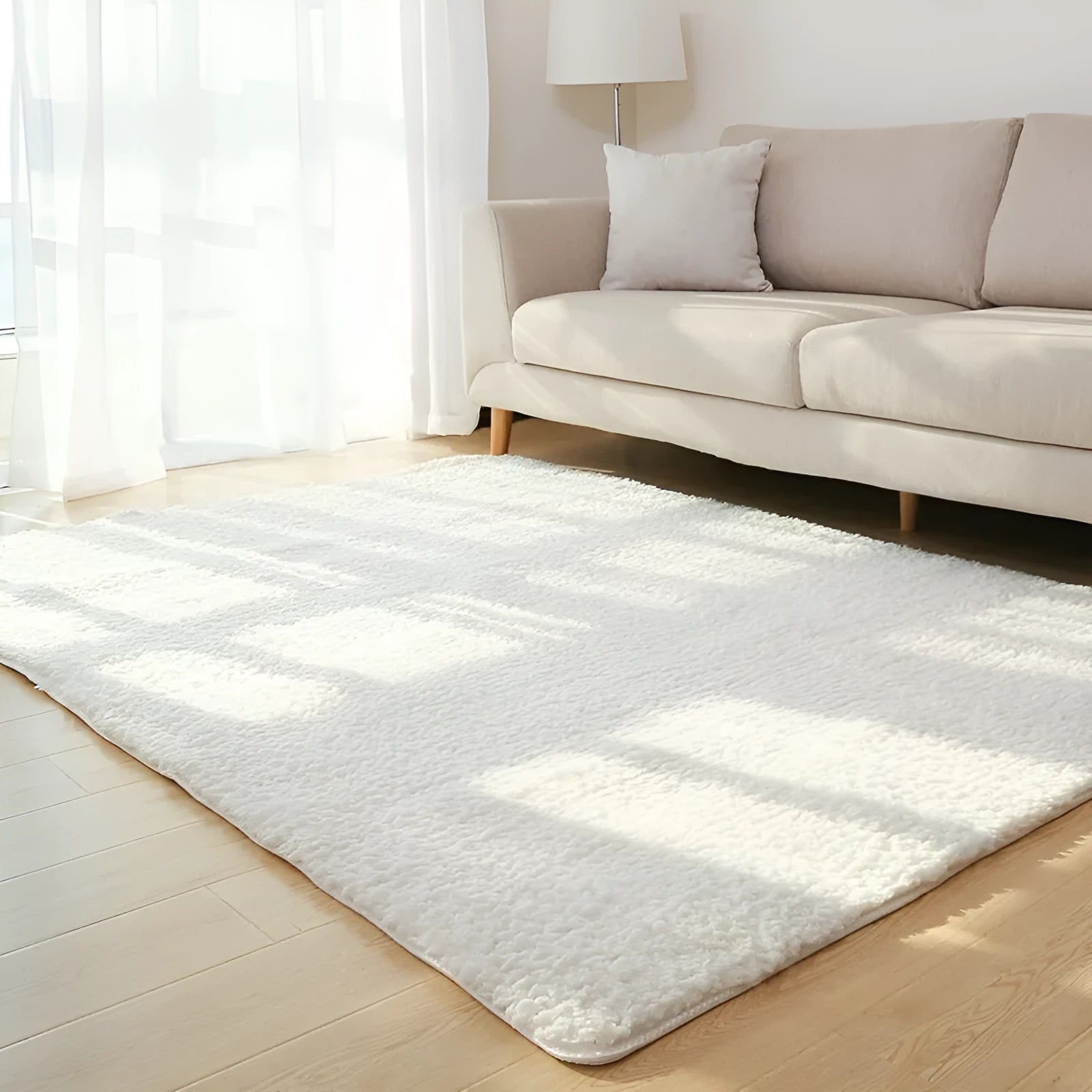 White plush rectangular area rug with a dotted non-slip bottom, shown at 40cm x 40cm size.