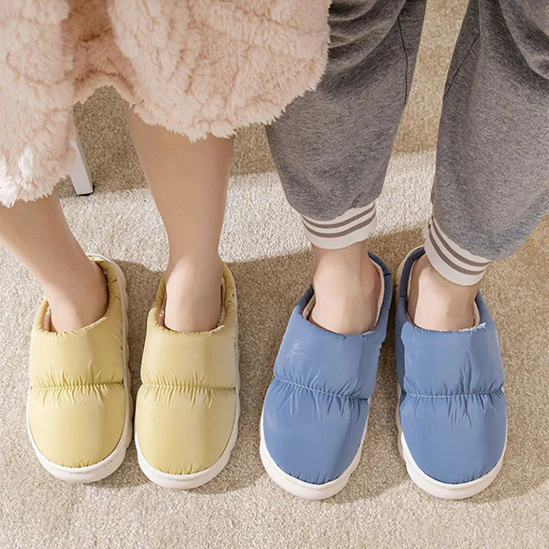 Blue winter slippers with artificial leather upper and thick rubber sole, showing plush lining.