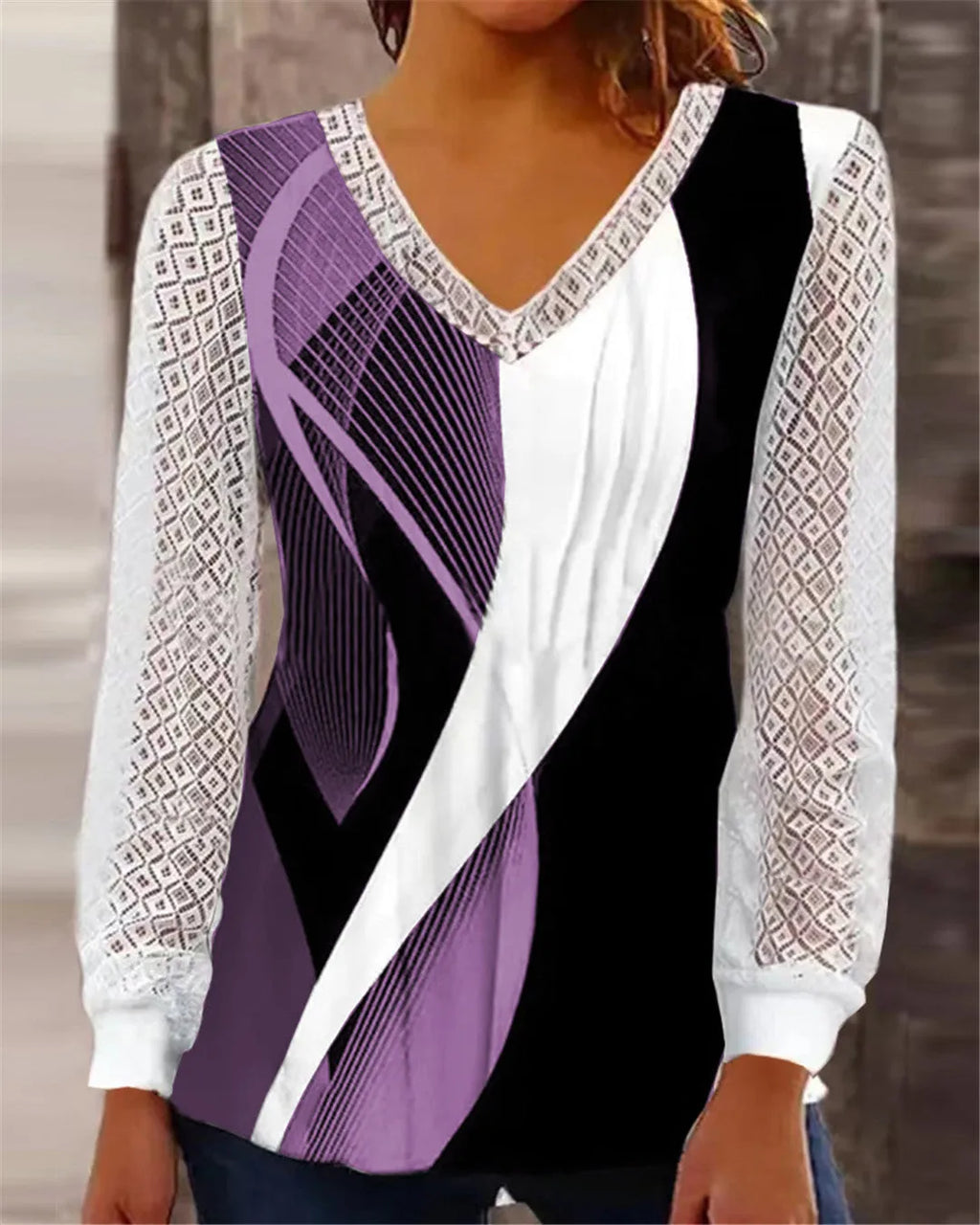 Women's purple V-neck loose top with long sleeves and a hollow-out lace print pattern.