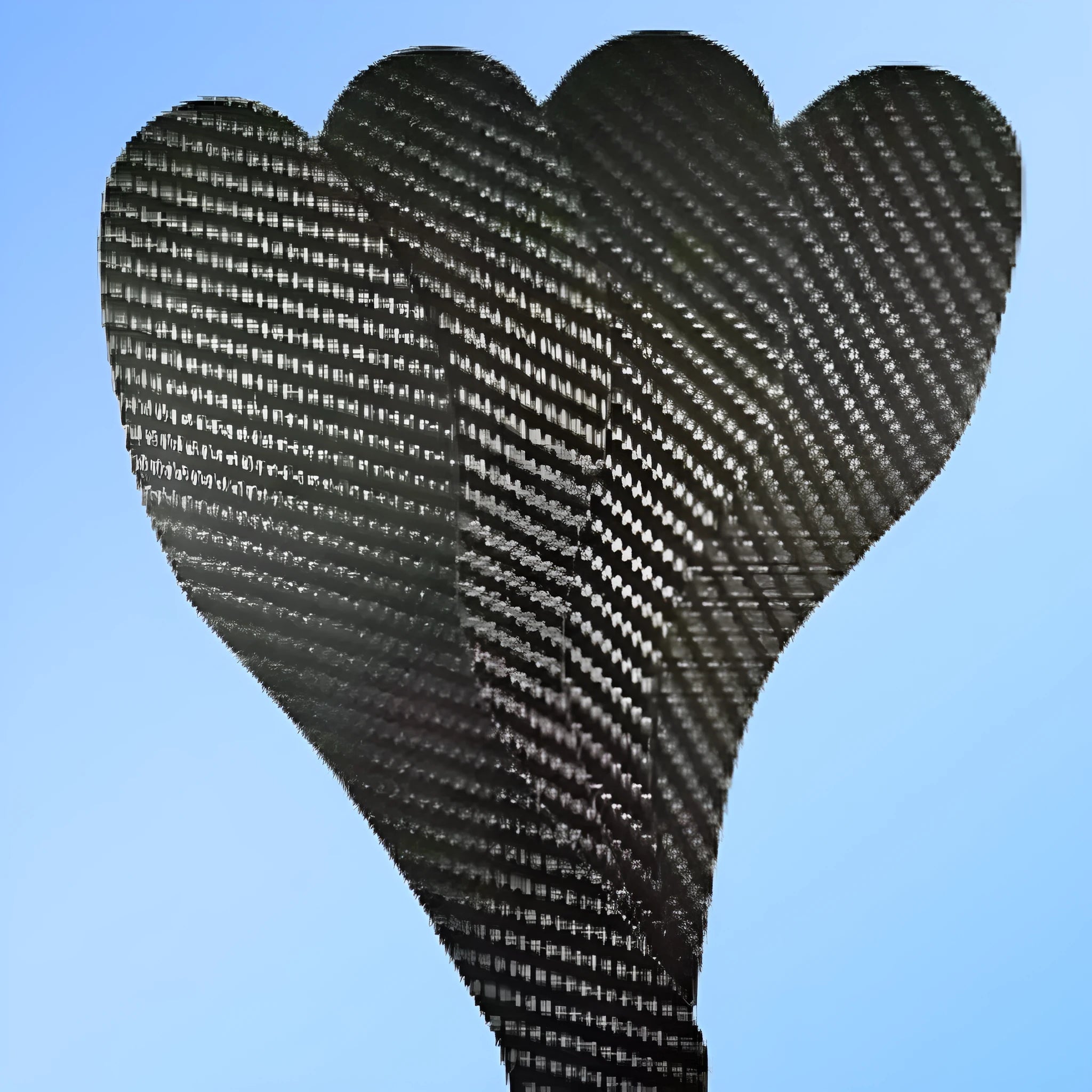A pair of thin, black 3K carbon fibre running insoles showing the textured weave pattern, placed next to a running shoe.