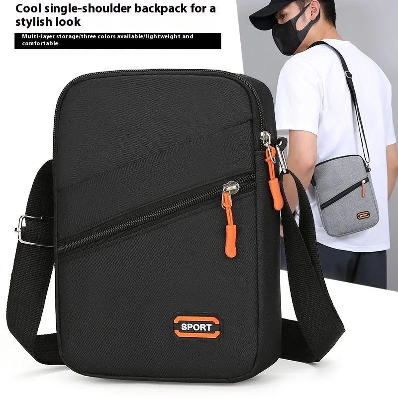 Ultra-light Oxford cloth crossbody commuter bag in silver grey with contrast colour detail.