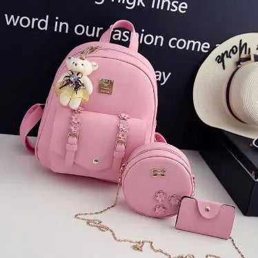 Women's three-piece backpack set with floral design including backpack, shoulder bag, and card holder
