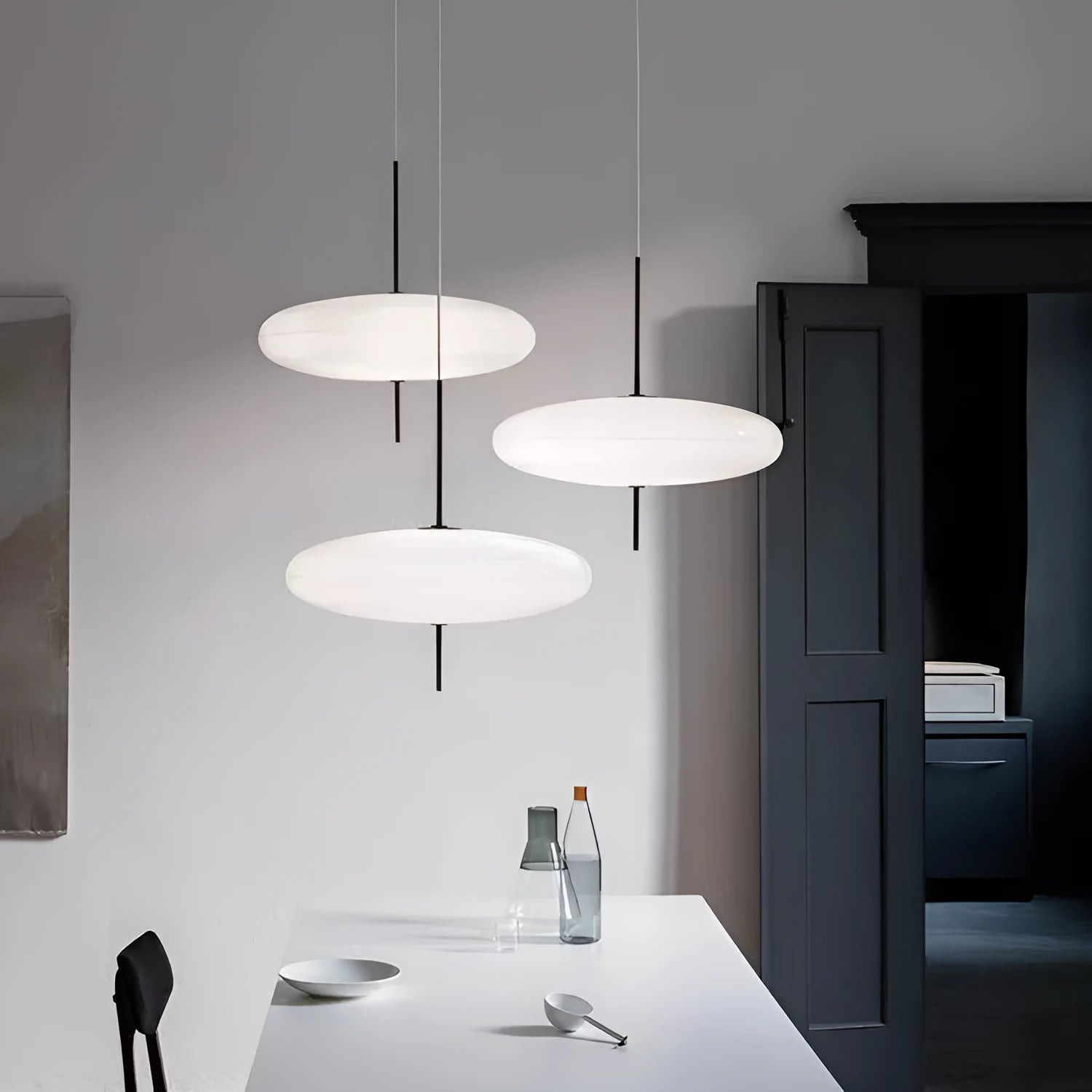 Nordic retro UFO-shaped designer chandelier ceiling light in all white or black and white finish.
