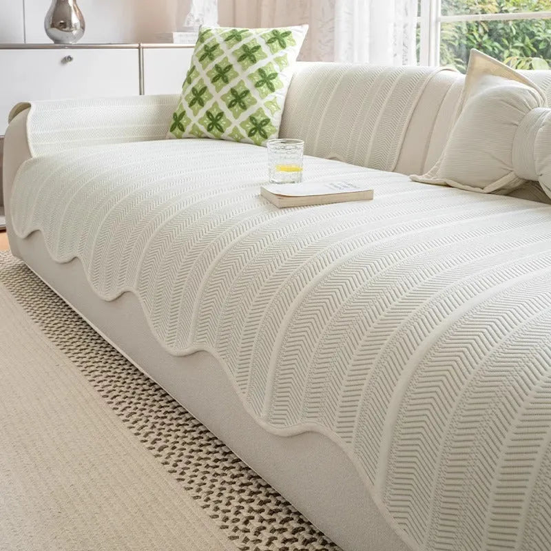 Ice Silk special-pattern sofa cover in Jelly Green laid over a grey sofa, showing non-slip edges.