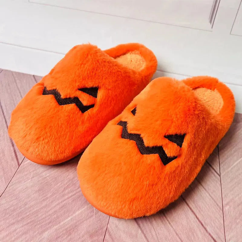 Orange Halloween pumpkin slippers with coral velvet upper and plush lining on non-slip PVC soles