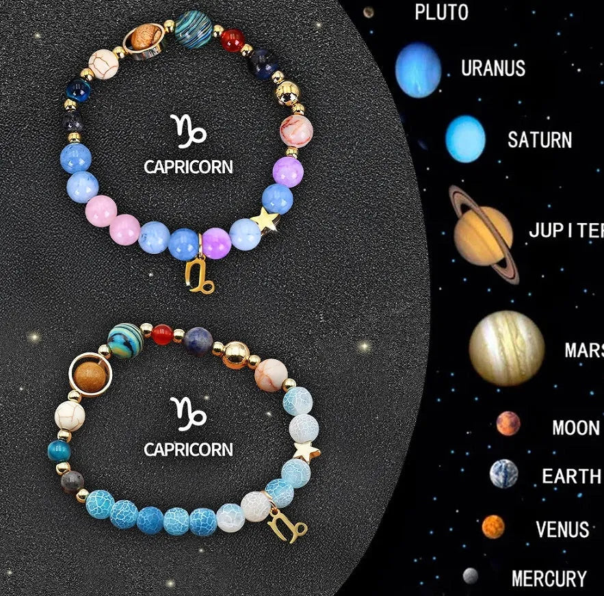 Two adjustable natural stone beaded bracelets with metal zodiac sign charms on a wooden surface.