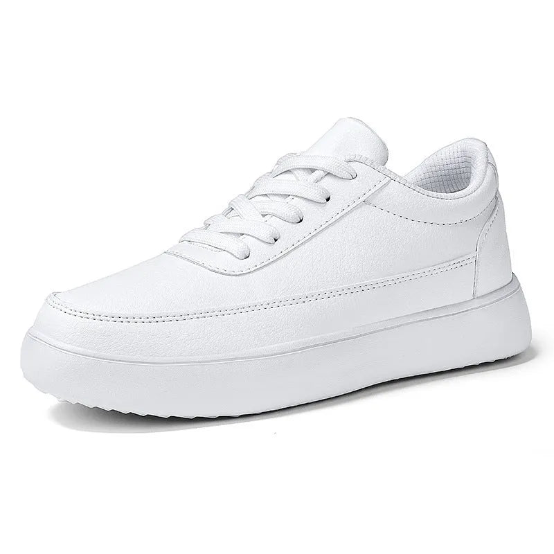 Women's white leather flat casual shoes with front lace-up closure.
