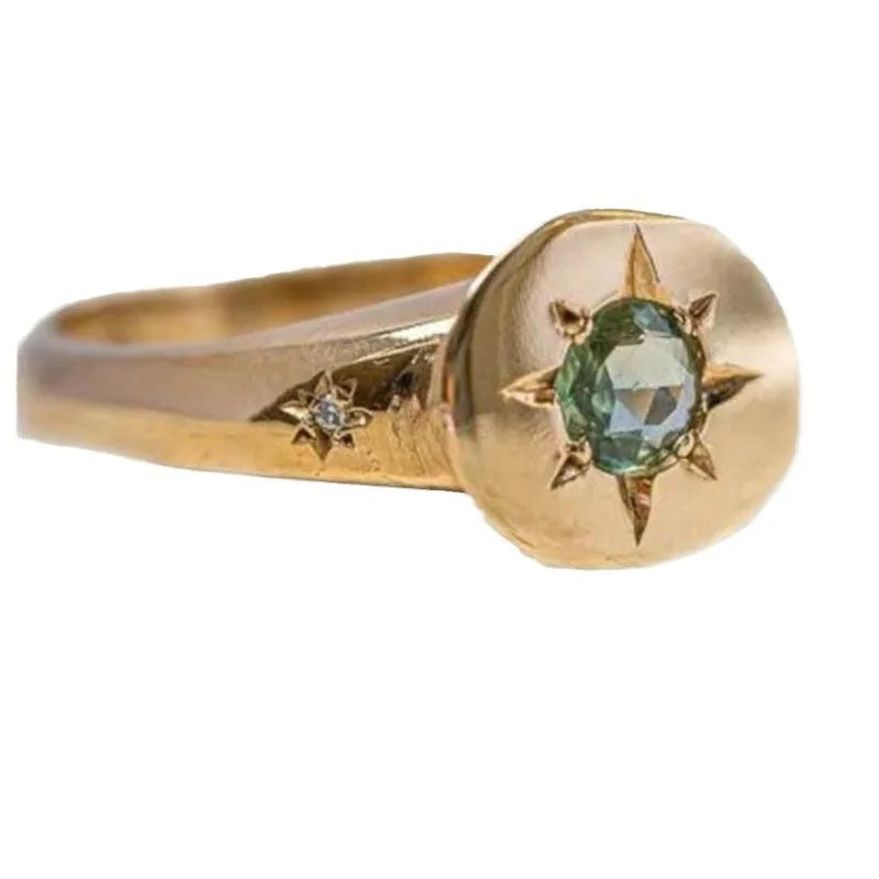 Gold oval asterism zircon ring with adjustable opening and star-shaped micro inlay design