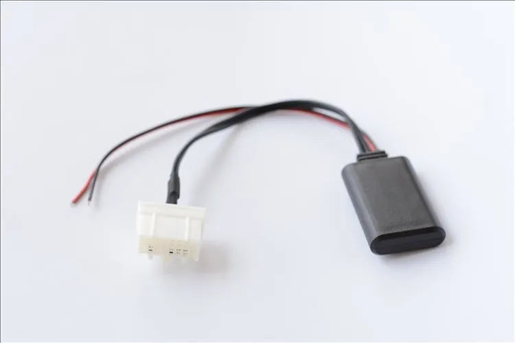 Black Mazda Bluetooth audio cable adapter for 2006 and newer 3, 6, M3, M6, MX5 models.