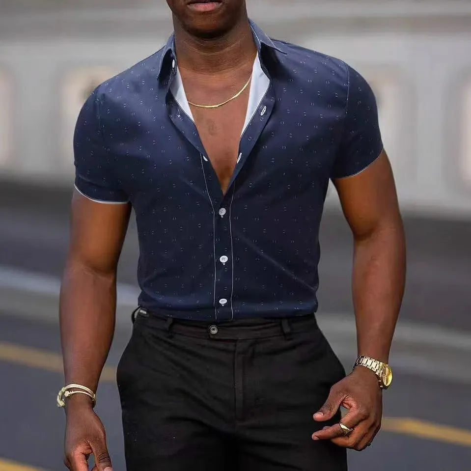 Man wearing a light blue short-sleeved shirt with an all-over floral print and a regular cardigan fit.